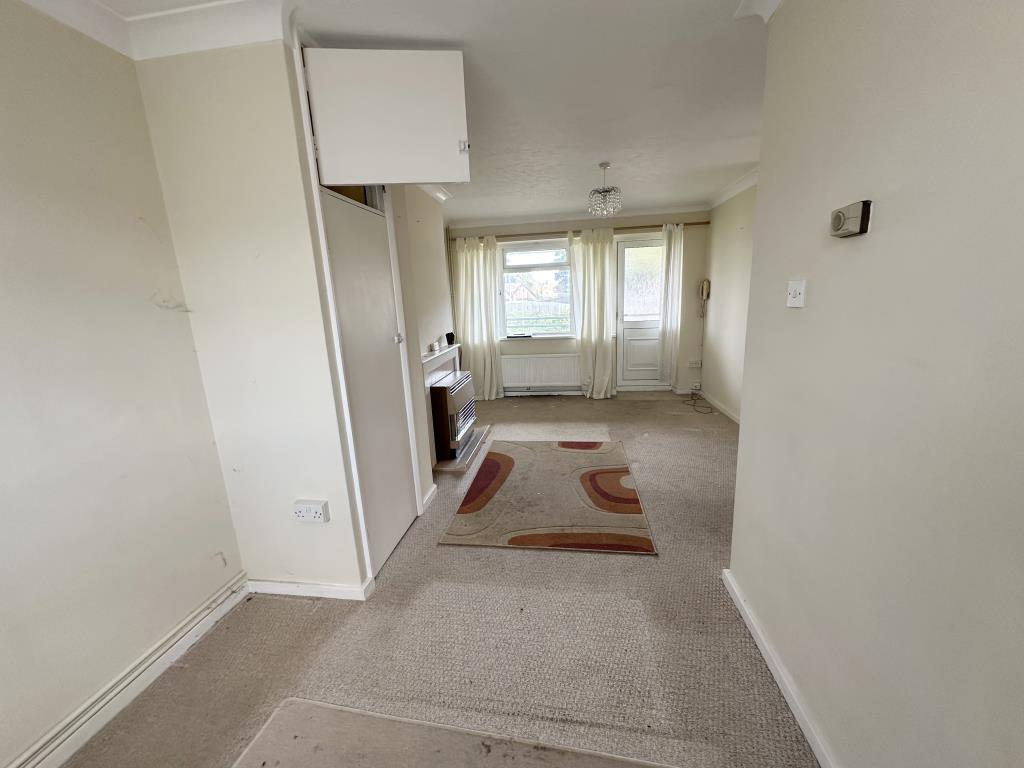 Lot: 144 - SELF-CONTAINED ONE-BEDROOM FLAT - Living room with balcony access